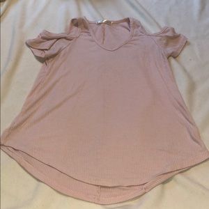 Pink blouse, off the shoulder.
